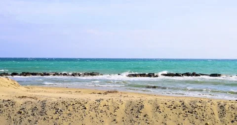 Powerful waves crash on the breakwaters Stock Footage 213276079