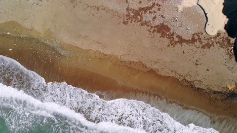 Powerful waves crashing on deserted sandy beach, top view Stock Footage 107277416