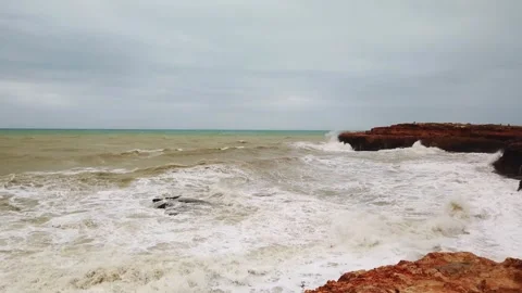 Powerful waves crashing over rocky coastline under stormy sky Stock-Footage 342022498