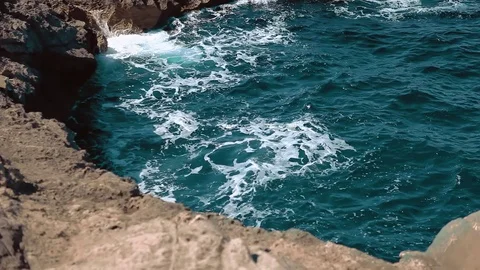 Powerful Waves Splashing stones on the beach   Video stock 78733736