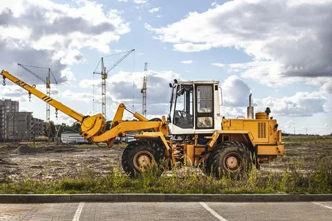 Powerful wheel loader for transporting bulky goods at the construction site Stock Photos