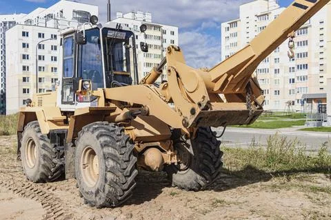 Powerful wheel loader for transporting bulky goods at the construction site Photos