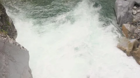 Powerful white water river flowing through rocky canyon in British Columbia Stock Footage 338360565