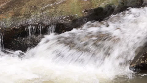 Powerful white water rushing over rocks in natural river cascade Video stock 335294249