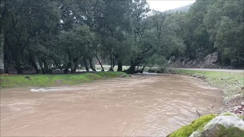 Powerful winter flood of the Admame River (Oued El Kedab) in Taza, Morocco. Stock Footage 332620935