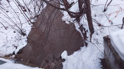 Powerful winter stream with rain and snow Stock Footage 324547949