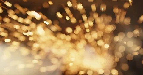 Powerful young woman using grinder and sparks flying impressivly into camera Stock Footage 86226507