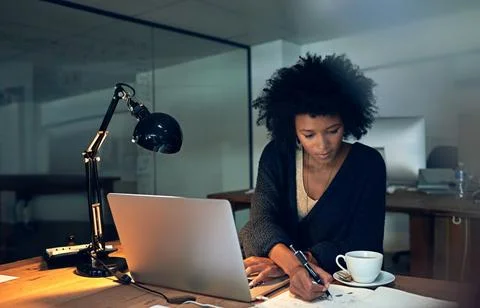 Powering through to knockout her deadlines. Cropped shot of a young businessw Stock Photos