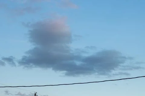 A powerline and clouds Stock Photos