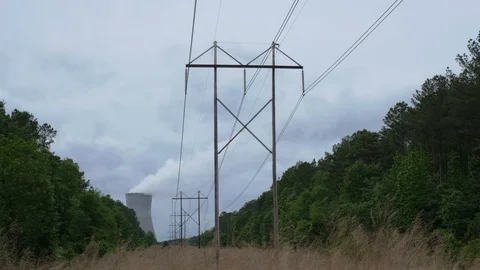 Powerlines and Nuclear Cooling Tower Stock Footage 108131061