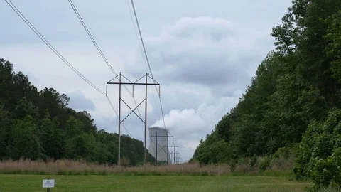 Powerlines and Nuclear Cooling Tower Stock Footage 108131082
