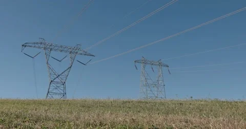 Powerlines in Grass Field, Slider Motion Left Stock Footage