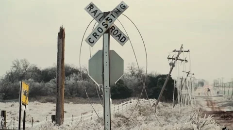 Powerlines on Rail Road Crossing during ice storm Video stock 59683345
