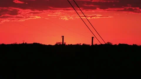 Powerlines silhouettes at sunset Stock Footage 12169825