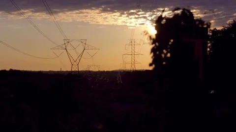 Powerlines at sunrise Stock Footage 77423409