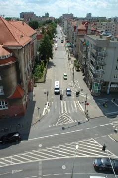 Poznan, Poland - July 11, 2014: Unidentified people and traffic on Mickiewicz Stock Photos