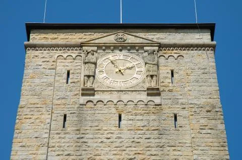 Poznan, Poland - July 13, 2014: Golden clock on emperor's castle tower in Poz Stock Photos