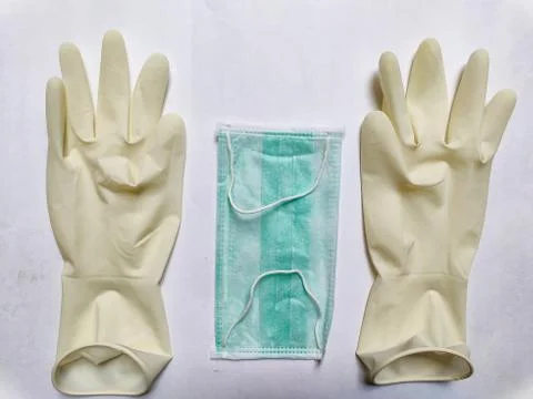 PPE items like hand gloves, face mask, and Sanitizer Foto stock