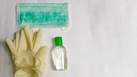 PPE items like hand gloves, face mask, and Sanitizer Stock Photos