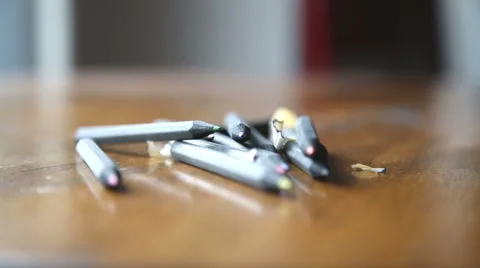 Ppencils laid on the table and on which falls gently sawdust Stock-Footage 55844015