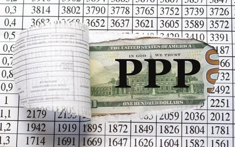 PPP - is the word behind torn office paper with numbers Stock Photos