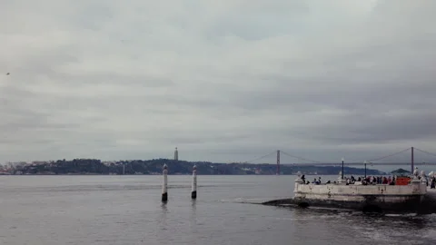 Praca do Comercio waterfront quay with Tagus river and bridge view in Lisbon Stock Footage 332222402