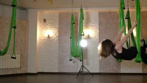 Practice of anti gravity fly yoga with hammock. 4K Stock Footage
