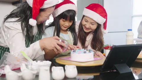 Practice baking a cake at home on a Digital Tablet on Christmas Day. Stock Footage 255627151