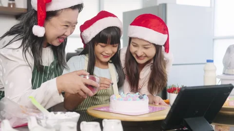 Practice baking a cake at home on a Digital Tablet on Christmas Day. Stock Footage 255627158