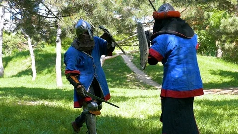 Practice blows with a sword in a training session in the park Stock-Footage 122080018