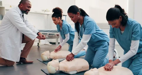 Practice, cpr and doctor with dummy in class for learning first aid, rescue or 库存影片 344238990