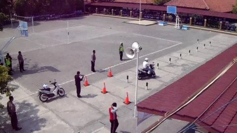 Practice driving license exam for two-wheeled motorcycles in Indonesia. Stock Footage 162879690