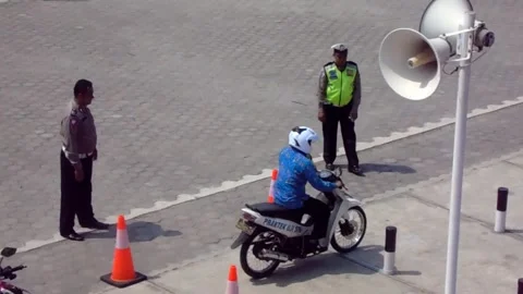 Practice driving license exam for two-wheeled motorcycles in Indonesia. Stock Footage 162879910