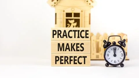 Practice makes perfect symbol. Concept words Practice makes perfect on wood.. Stock Photos