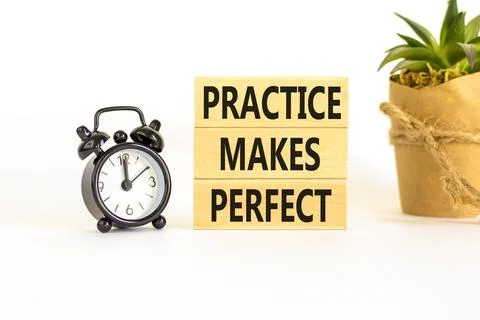 Practice makes perfect symbol. Concept words Practice makes perfect on wood.. Stock Photos