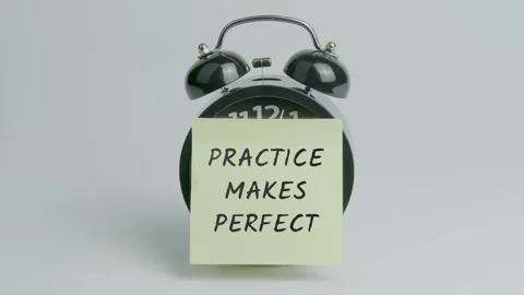 Practice Makes Perfect Text or Word on Yellow Note Paper Sticking onto Clock Stock Footage 299857290