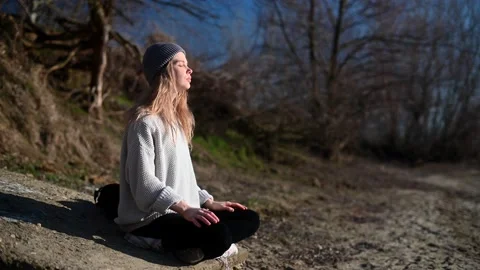 Practice of meditation and interaction with nature. Girl near river. Stock Footage 150462990