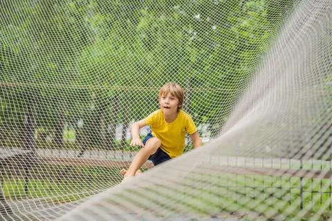 Practice nets playground. boy plays in the playground shielded with a protective Stock Photos