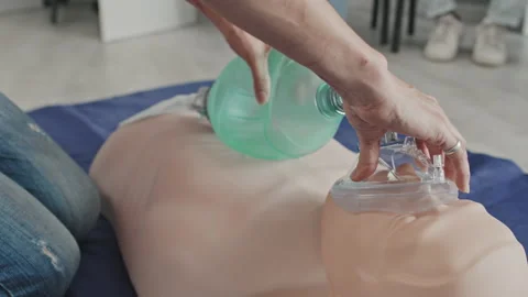 Practicing Artificial Ventilation On Dummy Stock Footage 223932730