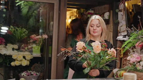 Practicing bouquet making techniques. Training in floral arrangement and wiring Stock Footage 337657580