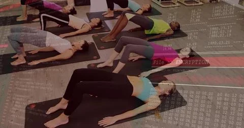 Practicing bridge pose six women in athletic wear on yoga mats in studio, with 写真素材