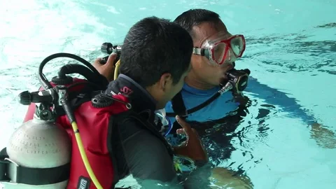Practicing diving in a swimming pool 스톡 동영상 126181514