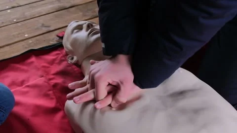 Practicing first aid on mannequin Stock Footage 144607276