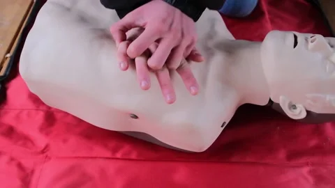 Practicing first aid on mannequin Stock Footage 144607447