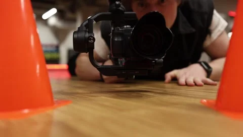 Practicing low angle video shooting Video stock 332902313