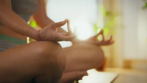 Practicing mindfulness through meditation in a peaceful indoor setting 스톡 동영상 301407247
