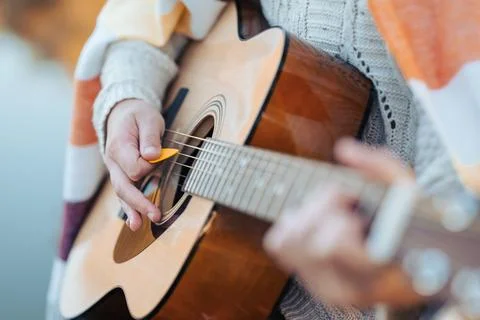 Practicing playing the instrument on the fresh air on a cool autumn evening Stock Photos