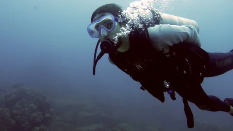 Practicing scuba diving in the waters of the Caribbean Sea underwater Stock Footage 100085801