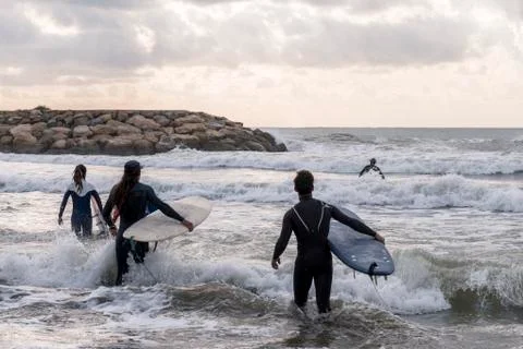 Practicing the sport of surfing Stock Photos