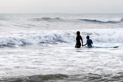 Practicing the sport of surfing Stock Photos